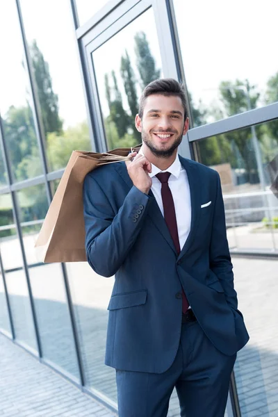 Businessman with paper bags — Stock Photo, Image