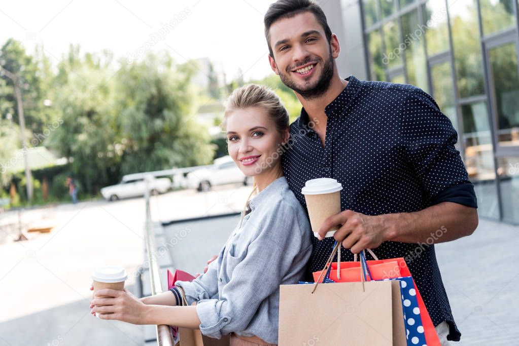 young couple with shopping bags