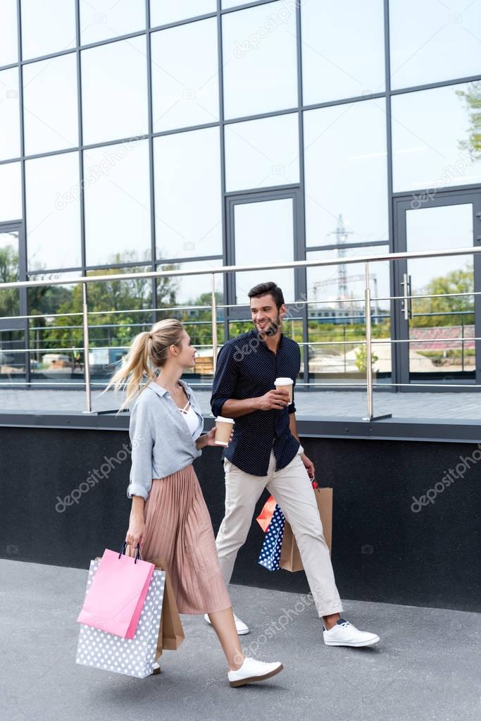 young couple with shopping bags