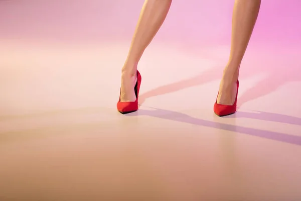 Legs in red heels — Free Stock Photo