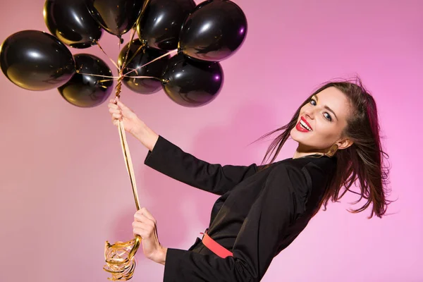 Mulher sorridente com balões — Fotografia de Stock