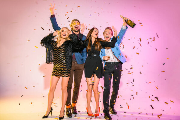 Friends on party with confetti — Stock Photo, Image