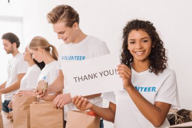 volunteer holding charity placard clipart