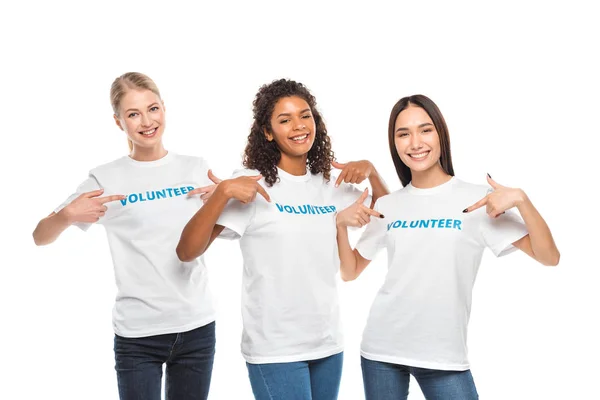 Volunteers pointing at signs on t-shirts — Stock Photo, Image