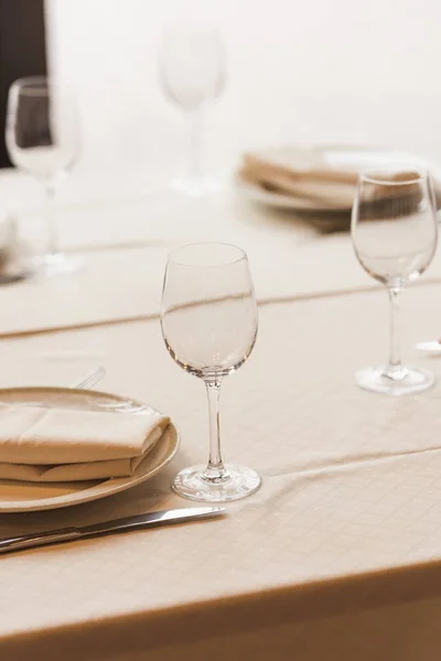 Served table with wineglasses and plates — Stock Photo, Image