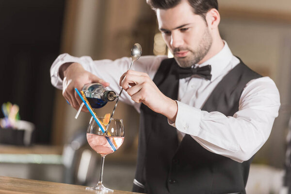 Barman making cocktail