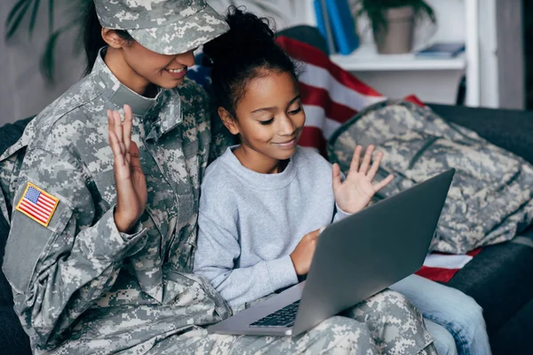 Soldier and child making video call — Stock Photo, Image