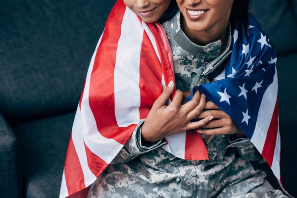 family wrapped with american flag