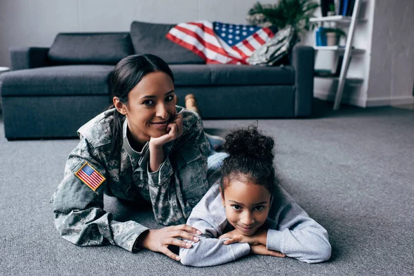 Daughter and mother in military uniform — Stock Photo, Image