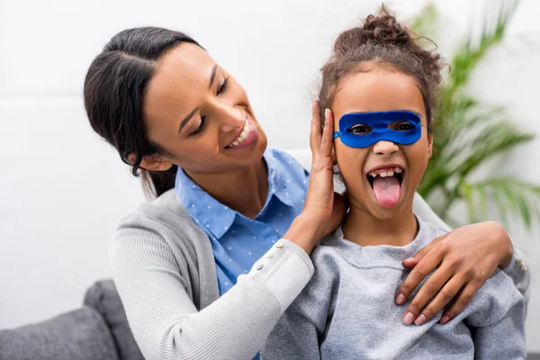 Daughter in superhero mask — Stock Photo, Image