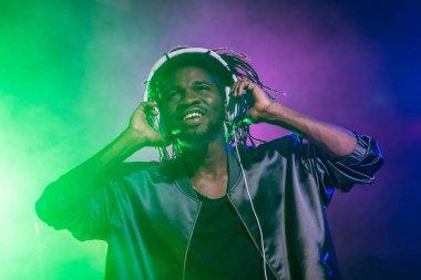 DJ in headphones on concert clipart