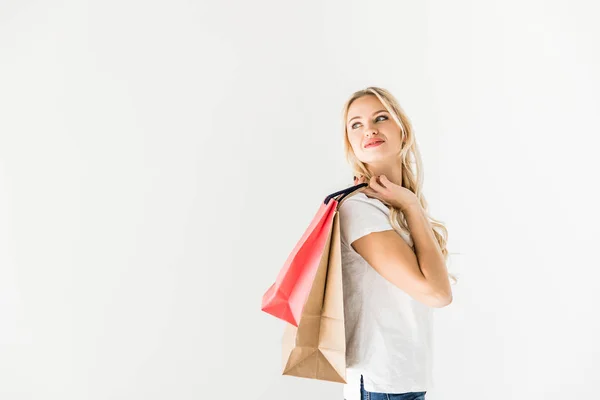 Jonge vrouw met boodschappentassen — Stockfoto