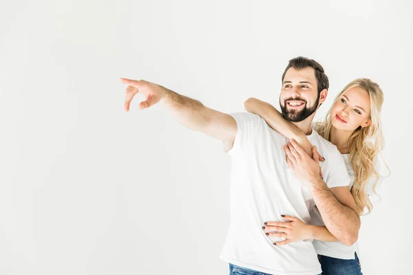 Casal apontando para longe com o dedo — Fotografia de Stock