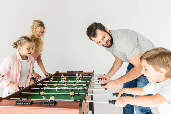 family playing foosball