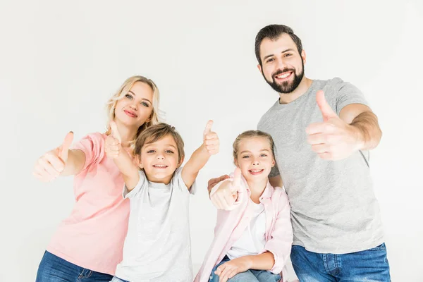 Familia feliz con pulgares hacia arriba — Foto de Stock