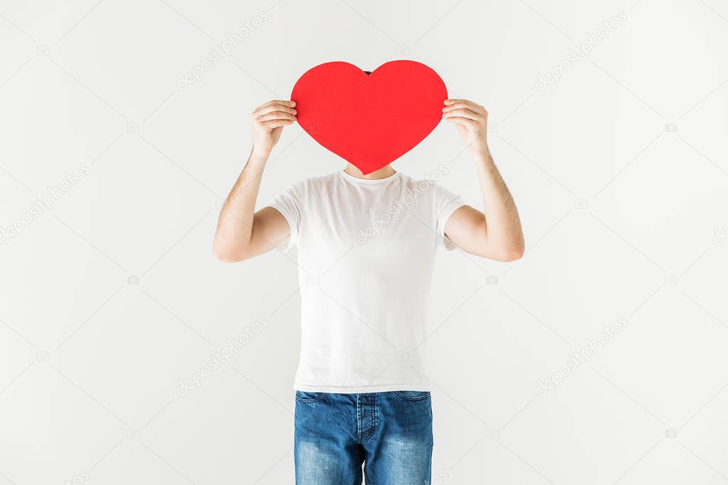 man holding heart symbol