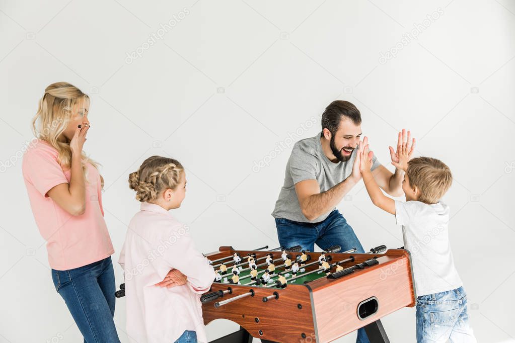 family playing foosball