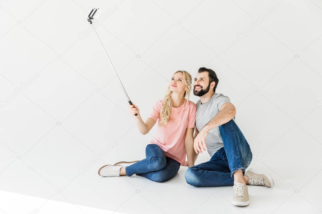 couple taking selfie with smartphone