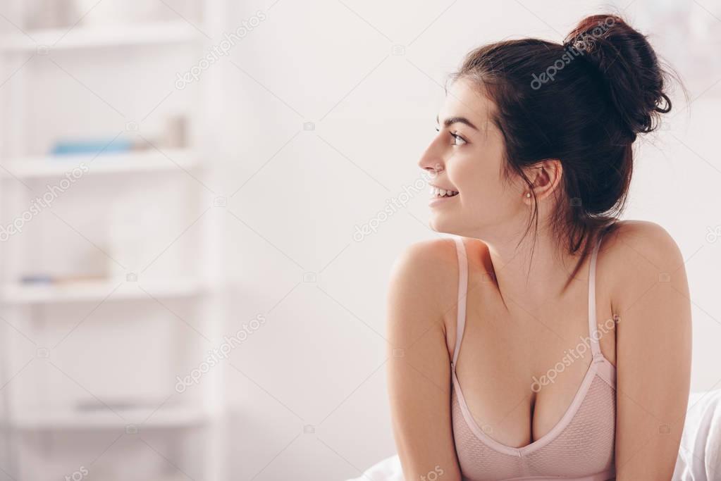 smiling woman in bed