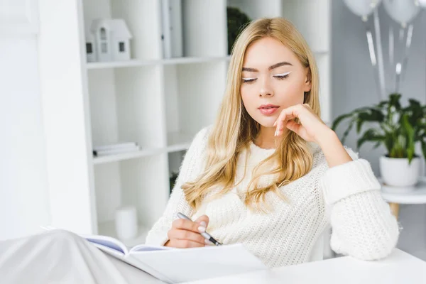Thoughtful businesswoman with paperwork — Stock Photo, Image