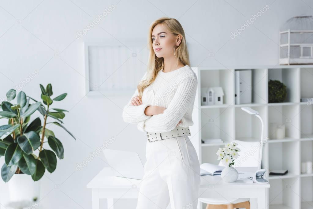 beautiful elegant businesswoman in light office 