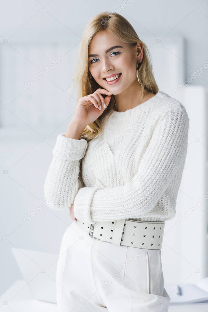attractive blonde woman in white clothes