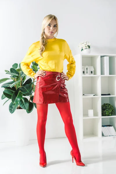 Fashionable businesswoman in red skirt — Stock Photo, Image