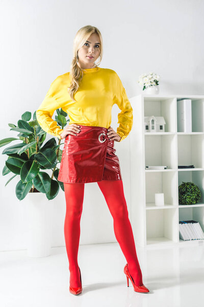 fashionable businesswoman in red skirt 
