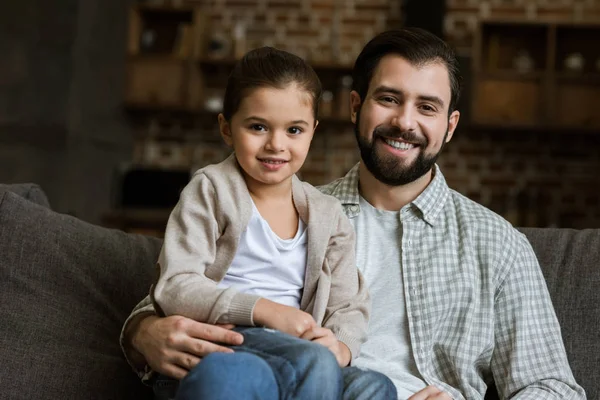 Happy Father Daughter Hugging Couch Looking Camera Home — Stock Photo, Image