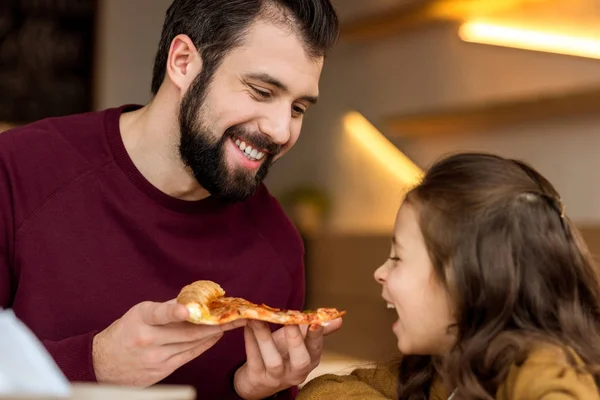 Father Giving Daughter Bite Piece Pizza — Stock Photo, Image