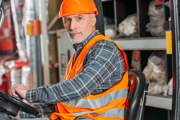 Senior Worker Safety Vest Helmet Sitting Forklift Machine Storage — Stock Photo, Image