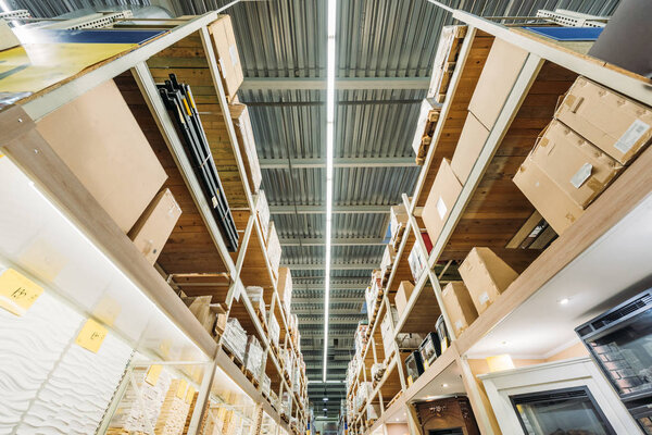 bottom view of shelves with boxes in warehouse