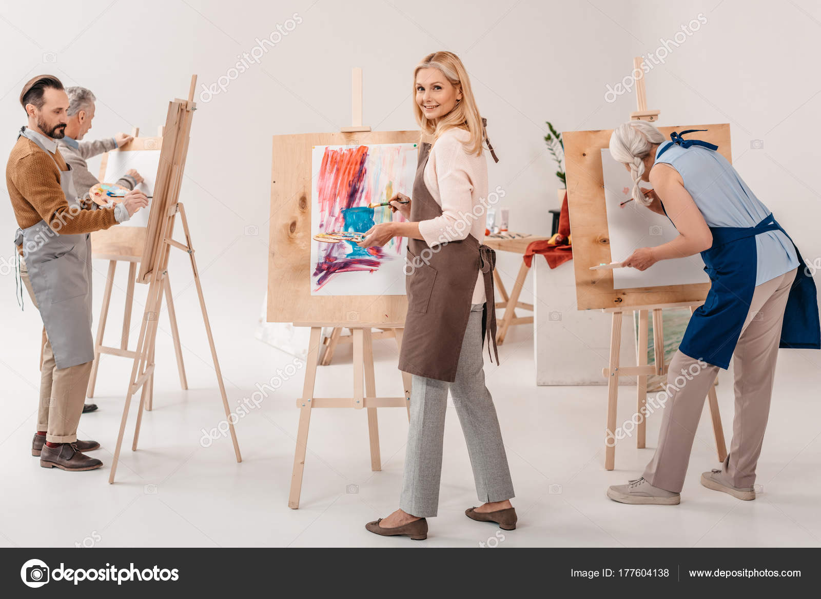 Male Female Adult Students Aprons Painting Together Easels Art Class Stock  Photo by ©AllaSerebrina 177604138