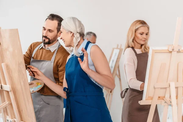 Adult Students Aprons Painting Easels Art Class — Stock Photo, Image