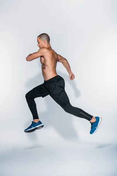 Side View African American Sportsman Jumping White — Stock Photo, Image