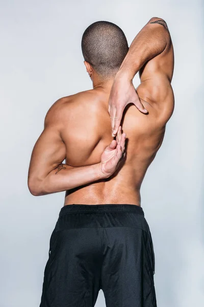 Rear View African American Sportsman Stretching Back Isolated White — Stock Photo, Image