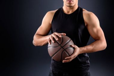 cropped shot of african american basketball player with ball on black clipart