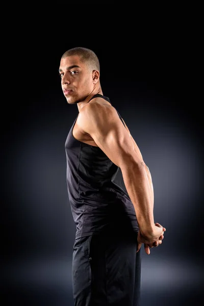 African American Sportsman Stretching Shoulders Workout Black — Free Stock Photo