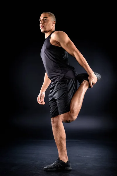Handsome African American Sportsman Stretching Leg Workout Black — Stock Photo, Image
