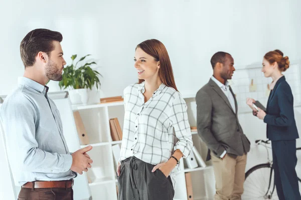 Smiling Multicultural Businesspeople Standing Talking Office — Stock Photo, Image