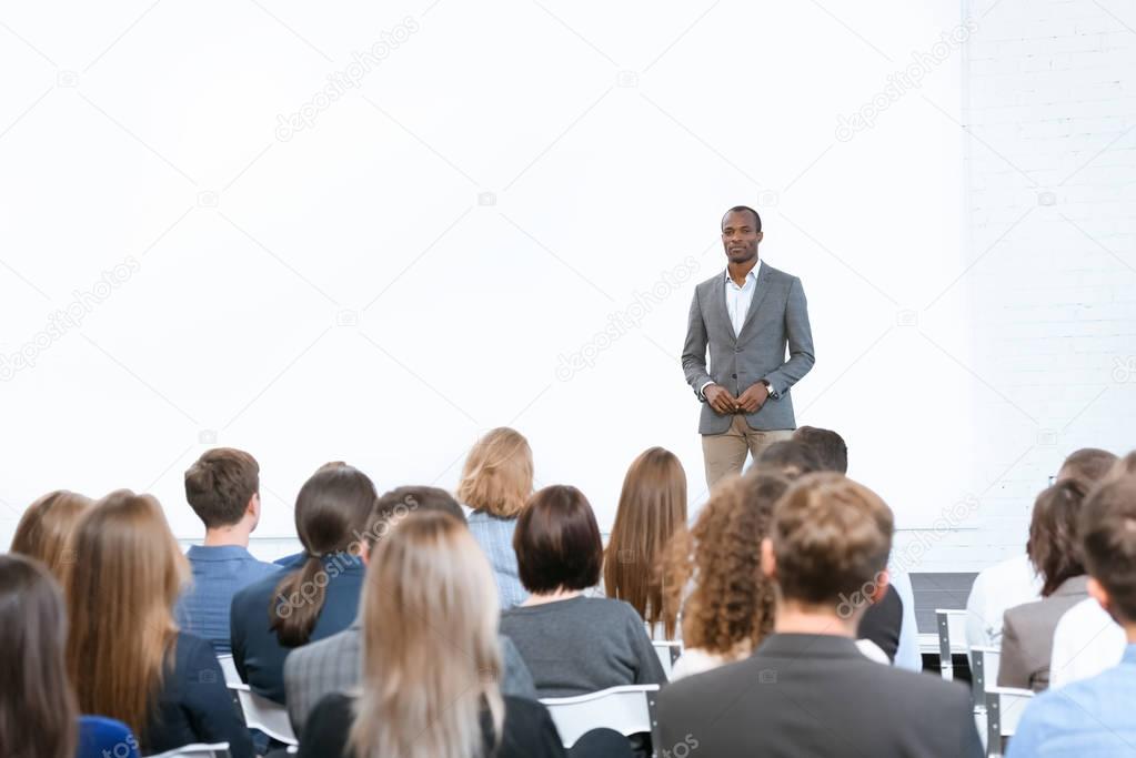 african man standing against copy space at meeting 