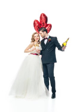 wedding couple with red heart shaped balloons and champagne isolated on white clipart