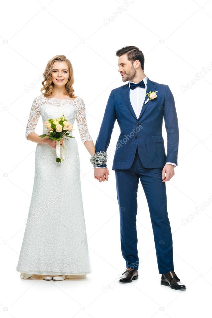 chained wedding couple holding hands isolated on white