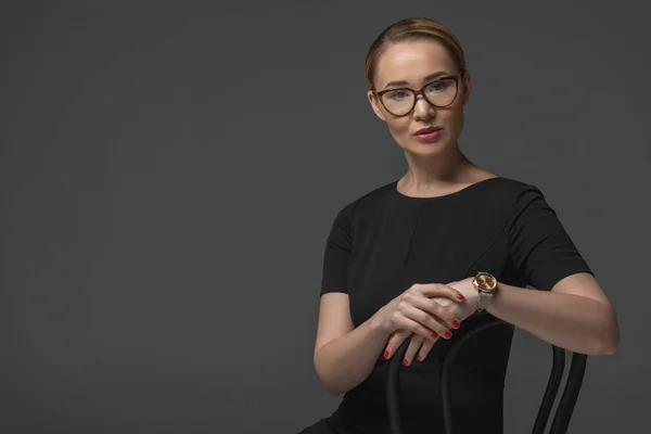 Beautiful Kazakh Woman Eyeglasses Sitting Chair Looking Camera Isolated Grey — Stock Photo, Image