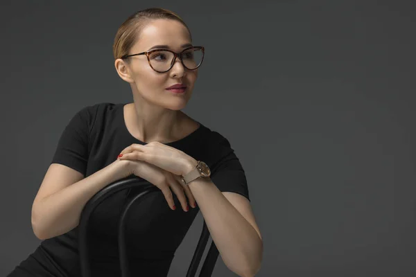 Beautiful Kazakh Woman Eyeglasses Sitting Chair Looking Away Isolated Grey — Stock Photo, Image