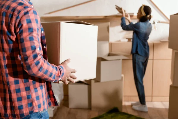 Cropped View African American Couple Holding Cardboard Box Moving New — Stock Photo, Image