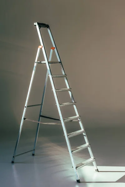 Open Metallic Stepladder Studio Grey — Stock Photo, Image