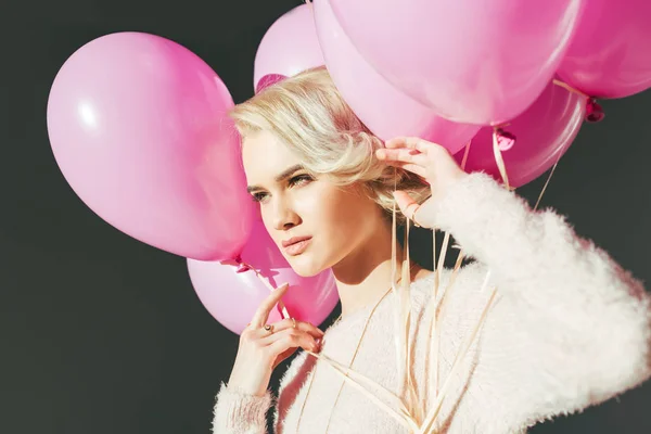 Beautiful Young Woman Holding Pink Balloons Looking Away Isolated Grey — Stock Photo, Image