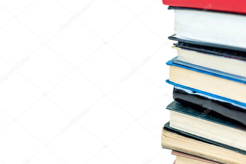 pile of colorful books, isolated on white with copy space