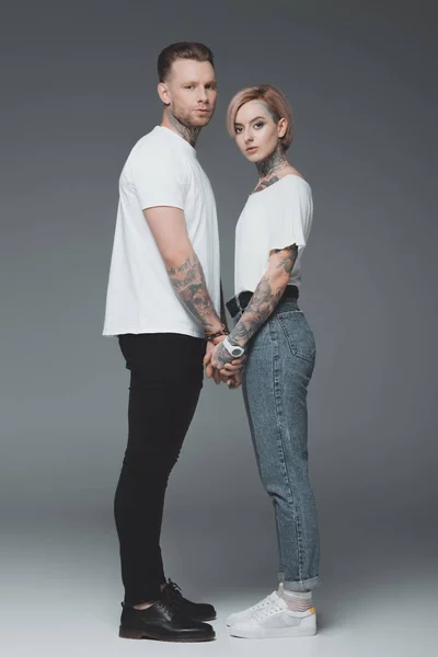 Beautiful Stylish Young Tattooed Couple White Shirts Holding Hands Looking — Stock Photo, Image